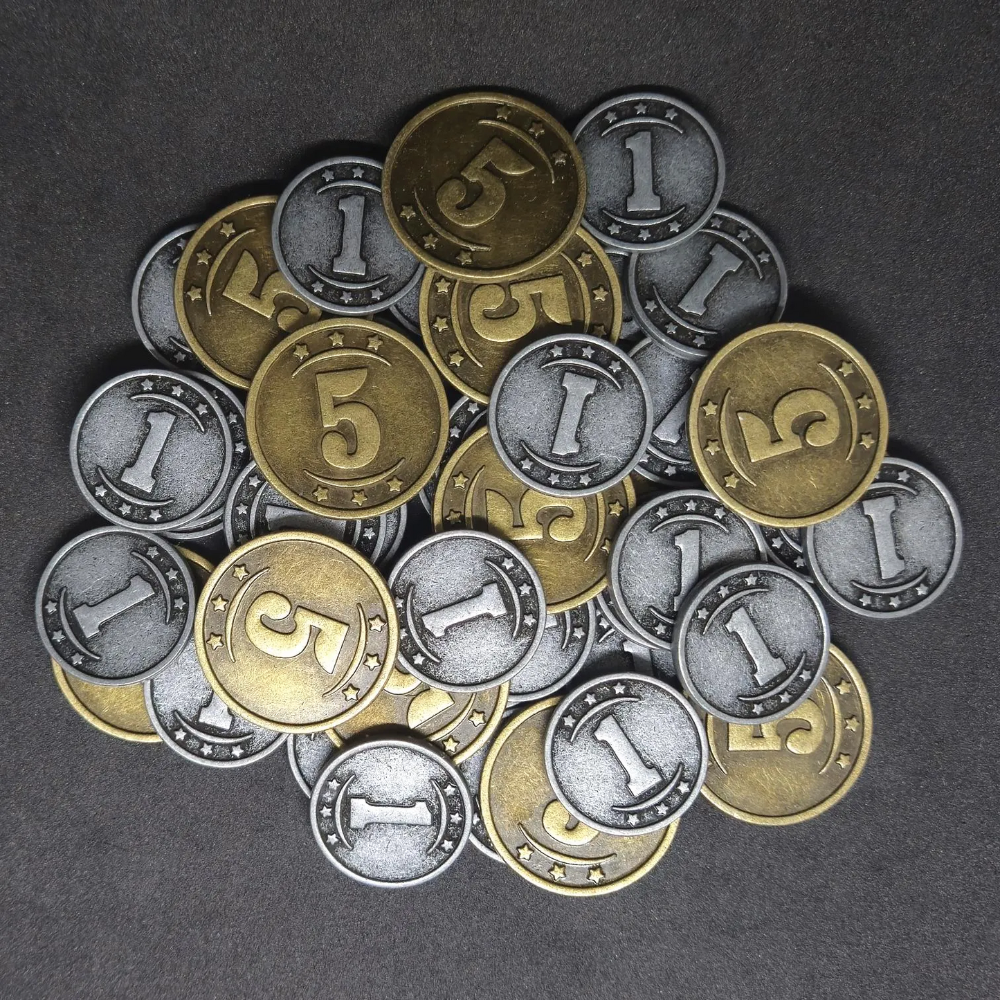 Set of silver and gold western metal coins of value 1 and 5 for board games