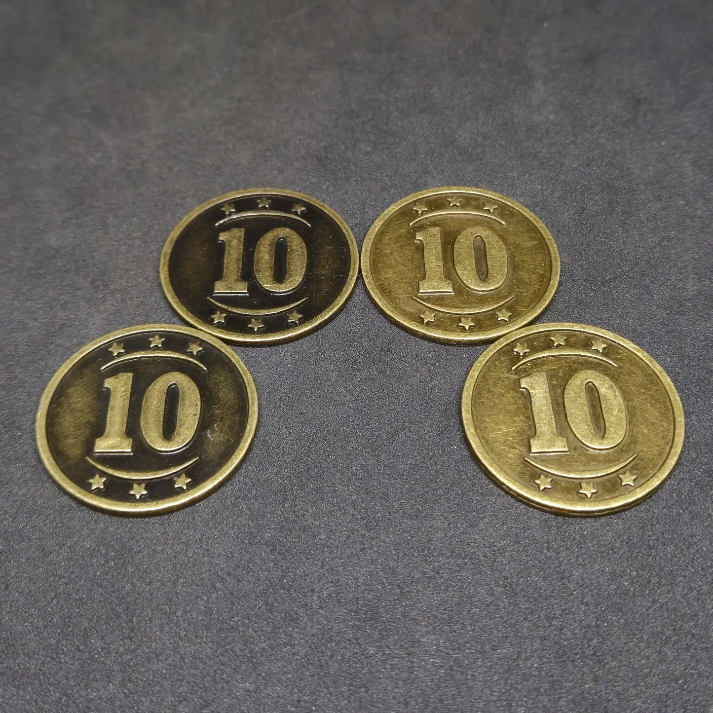 Set of bronze, silver and gold western metal coins of value 1, 5 and 10 for board games