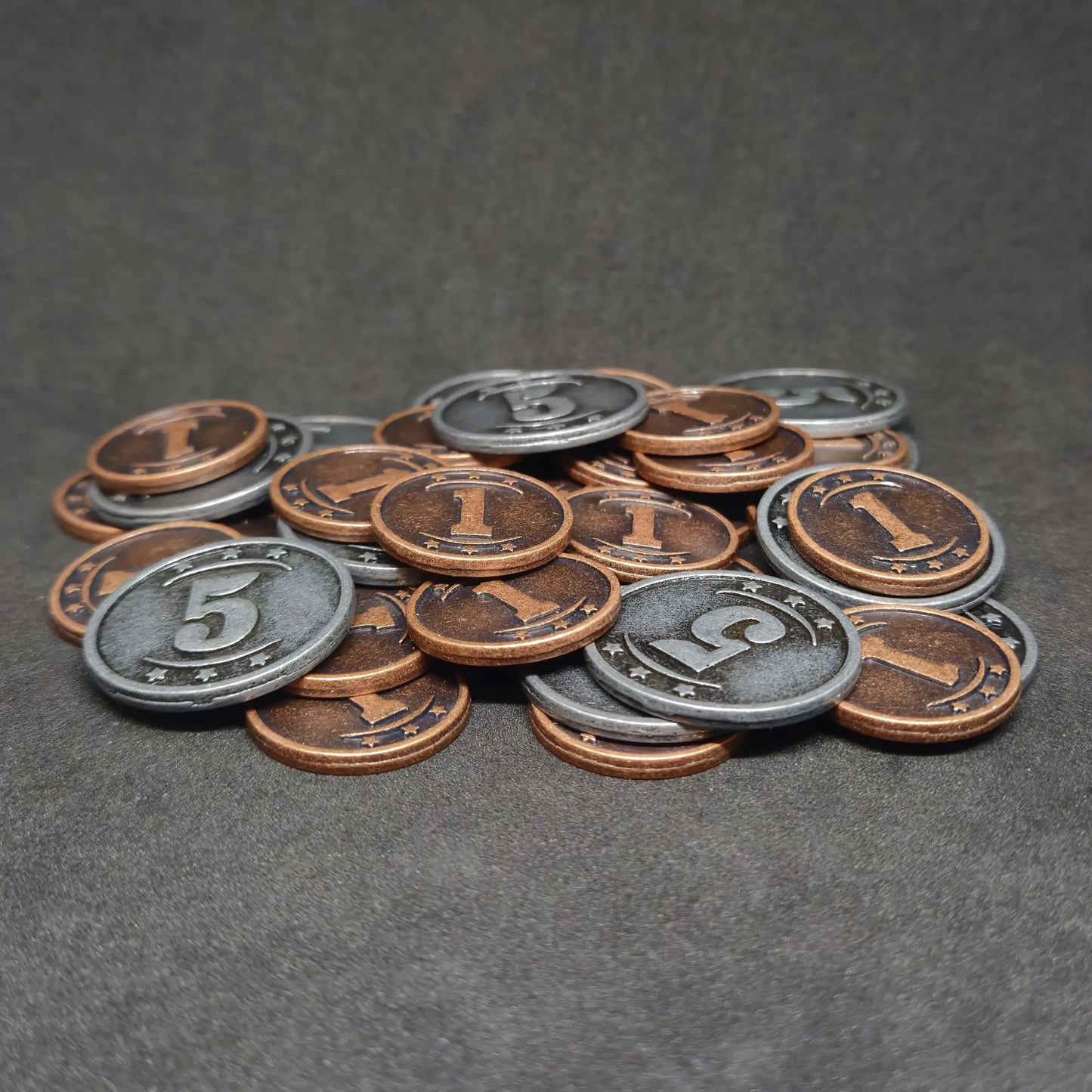 Set of bronze and silver western metal coins of value 1 and 5 for board games