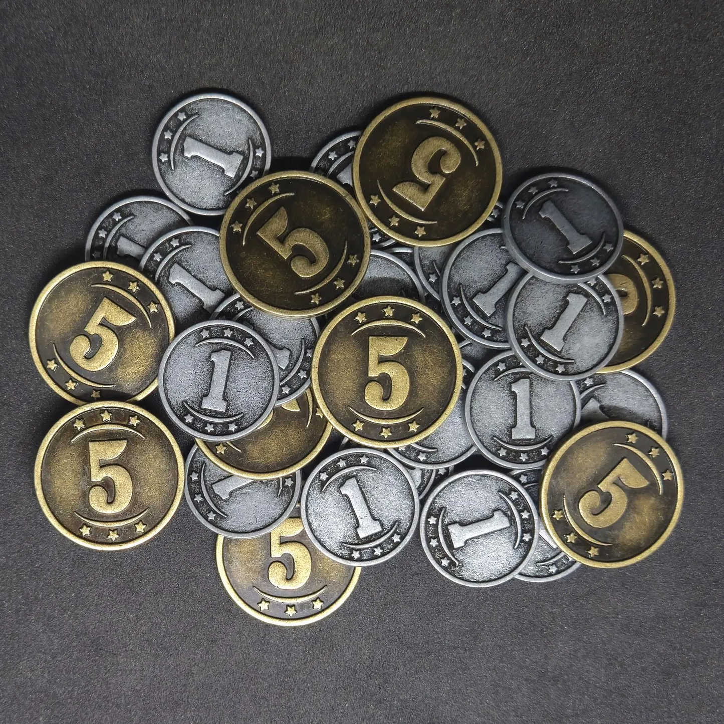 Set of silver and gold western metal coins of value 1 and 5 for board games