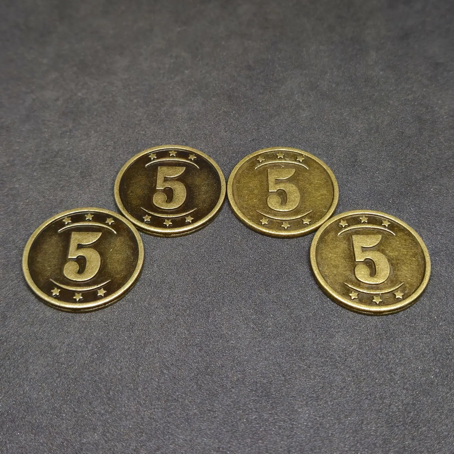 Set of silver and gold western metal coins of value 1 and 5 for board games