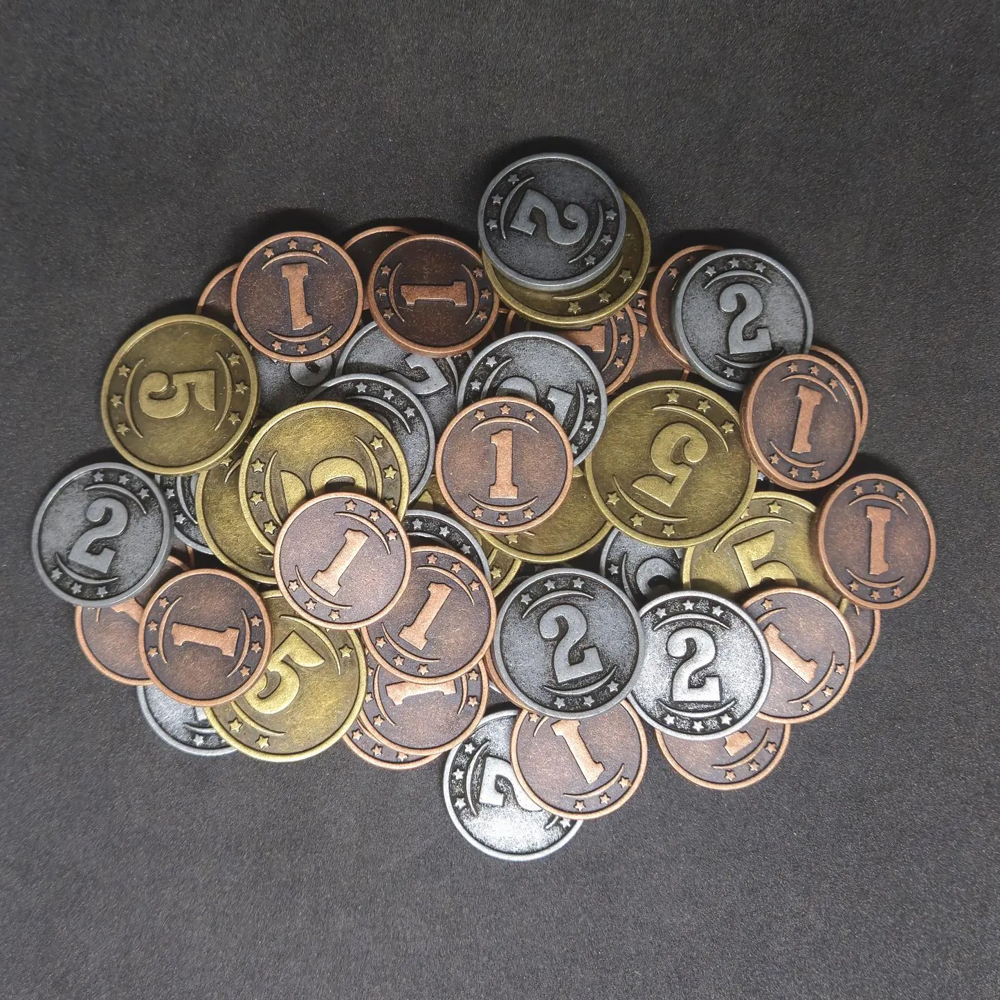 Set of bronze, silver and gold western metal coins of value 1, 2, and 5 for board games