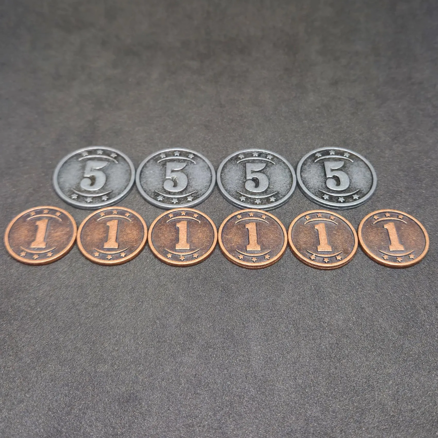 Set of bronze and silver western metal coins of value 1 and 5 for board games