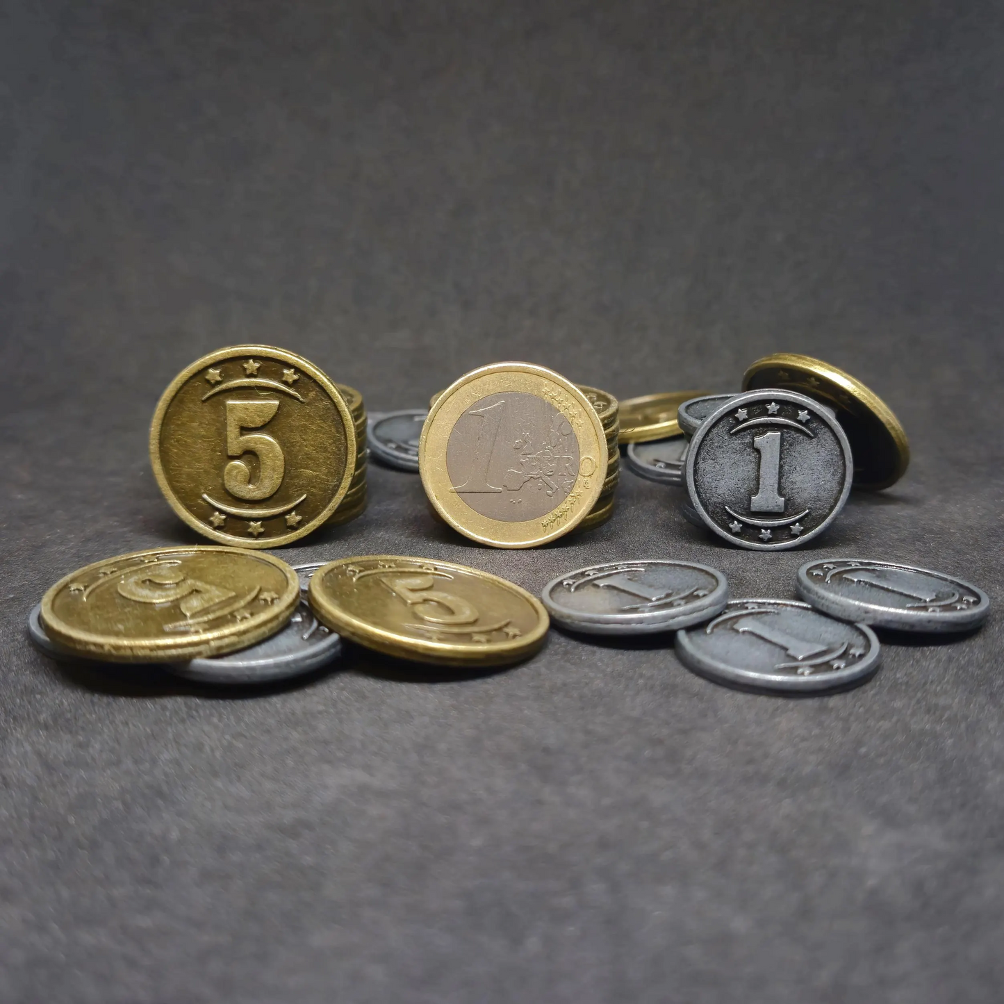 Set of silver and gold western metal coins of value 1 and 5 for board games