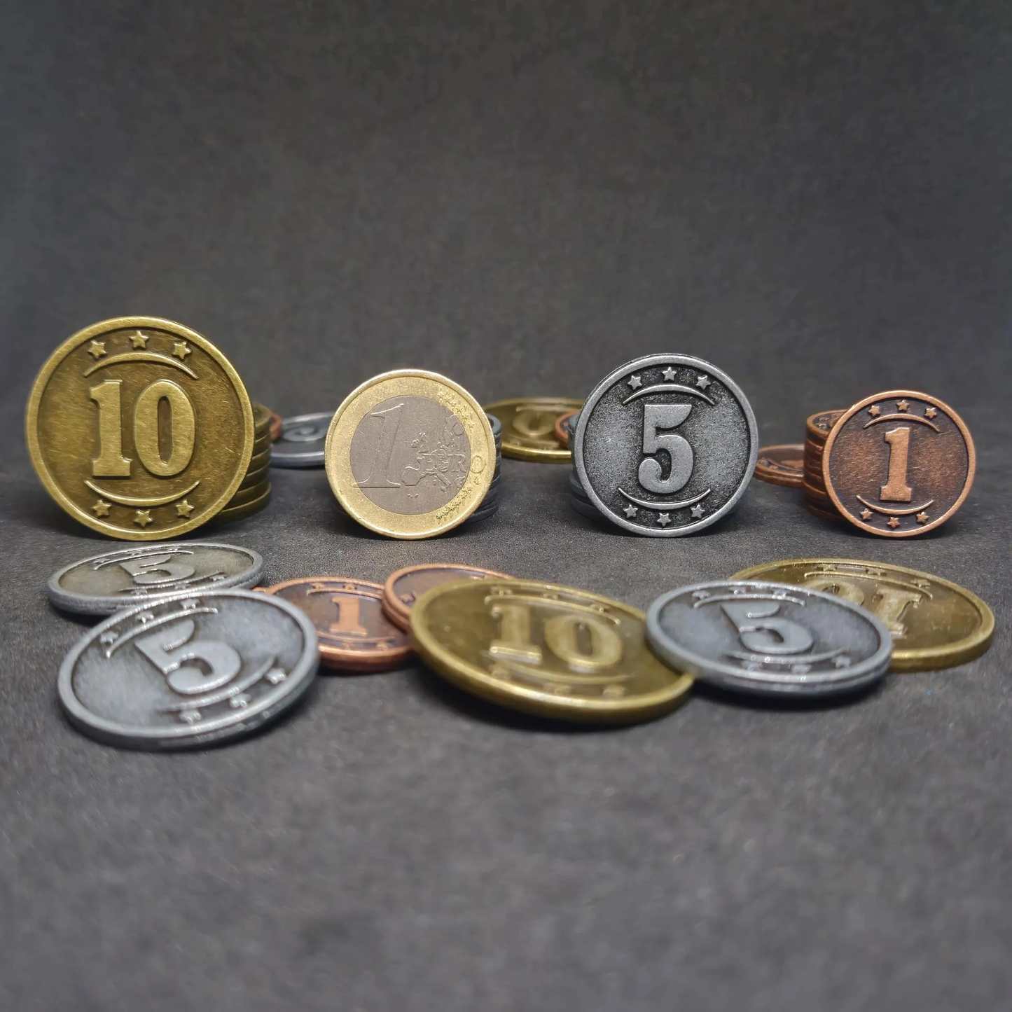 Set of bronze, silver and gold western metal coins of value 1, 5 and 10 for board games