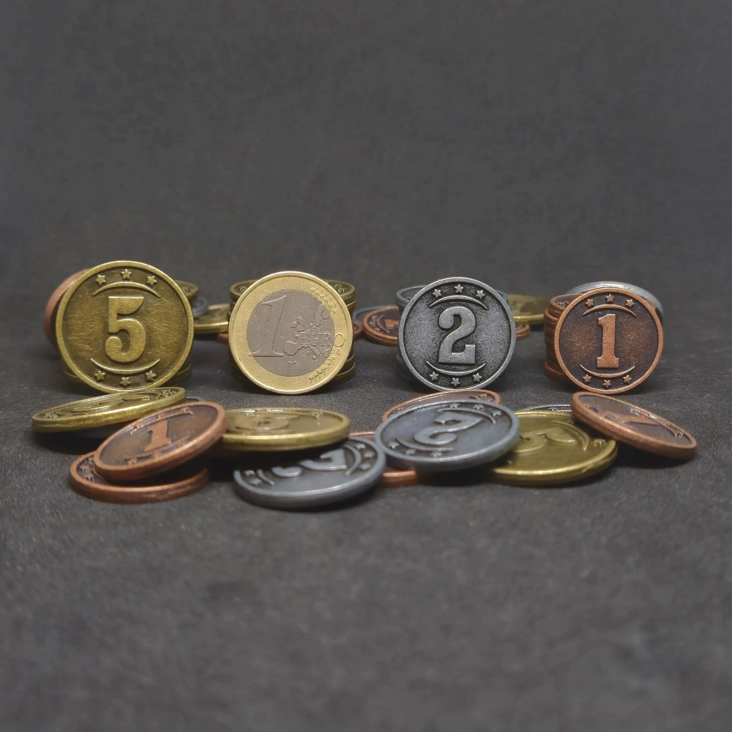 Set of bronze, silver and gold western metal coins of value 1, 2, and 5 for board games