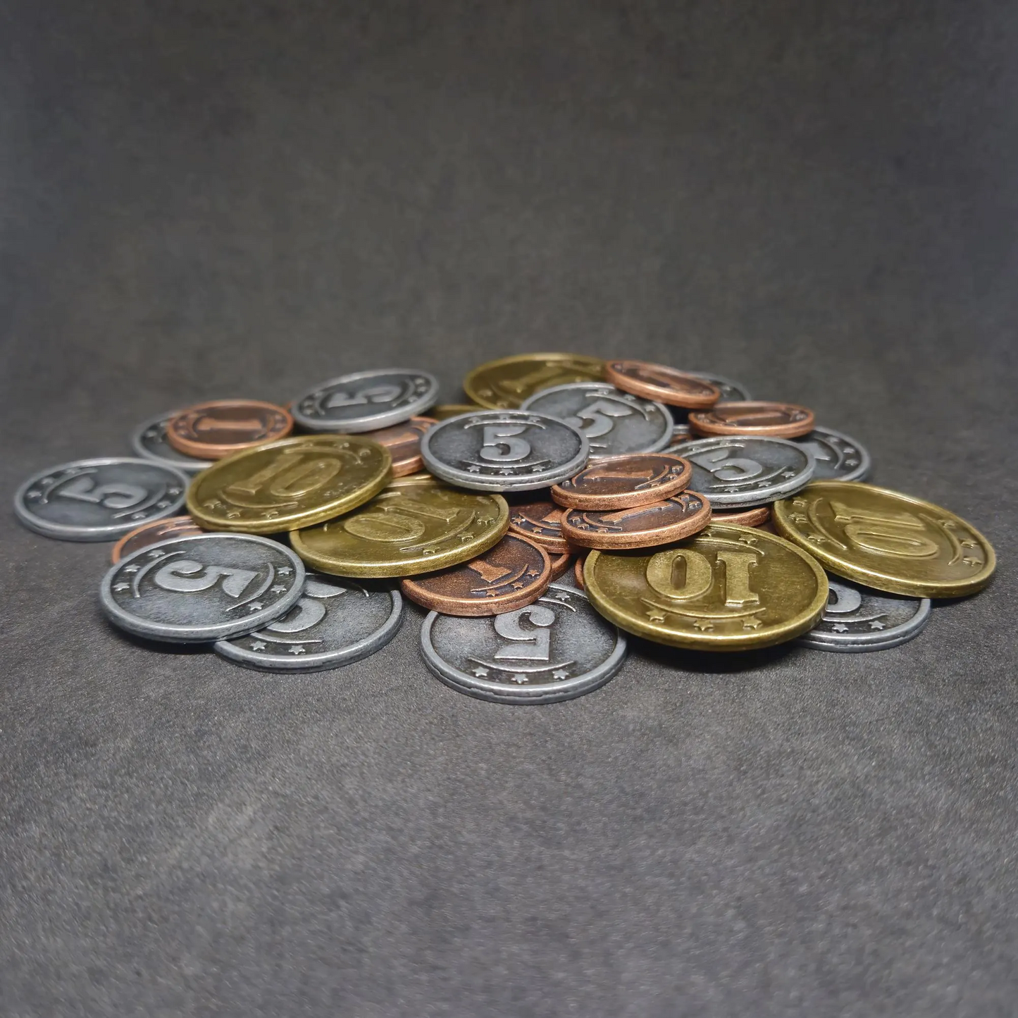 Set of bronze, silver and gold western metal coins of value 1, 5 and 10 for board games