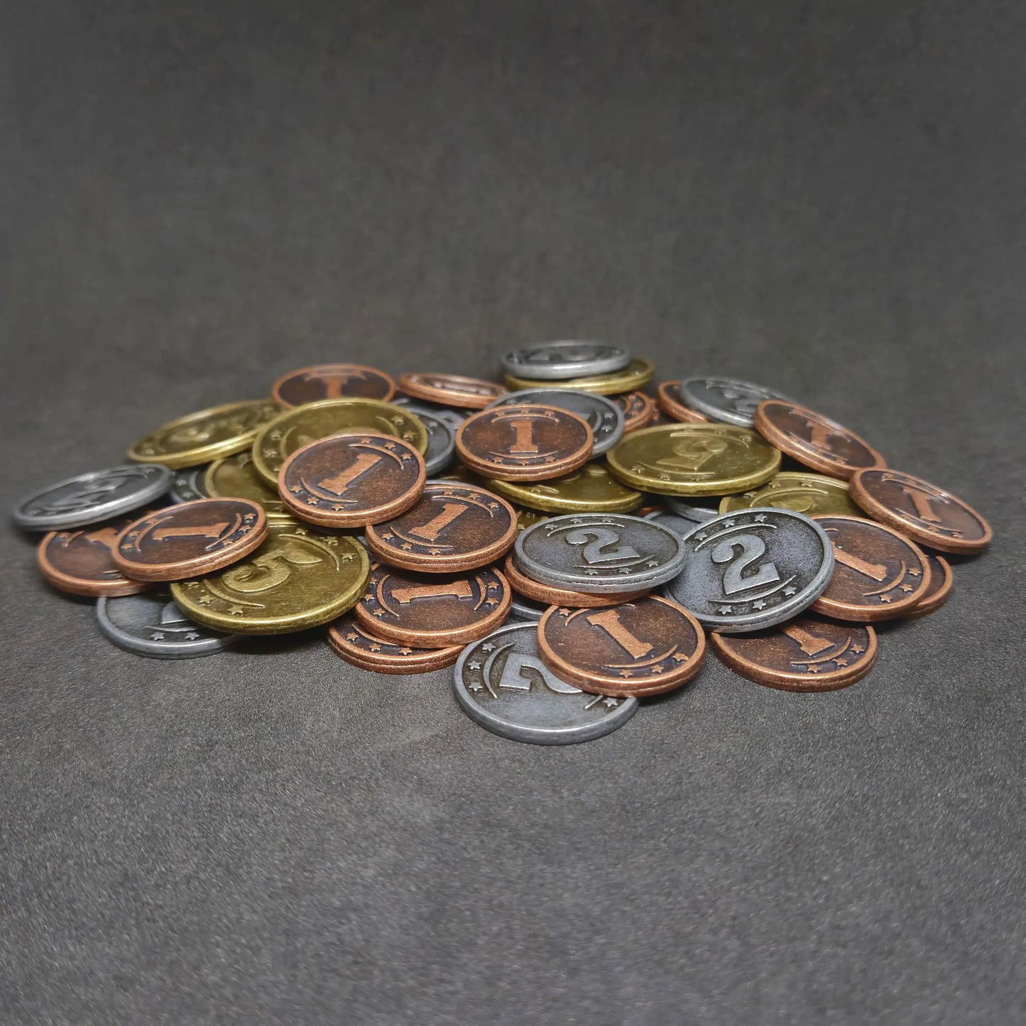 Set of bronze, silver and gold western metal coins of value 1, 2, and 5 for board games
