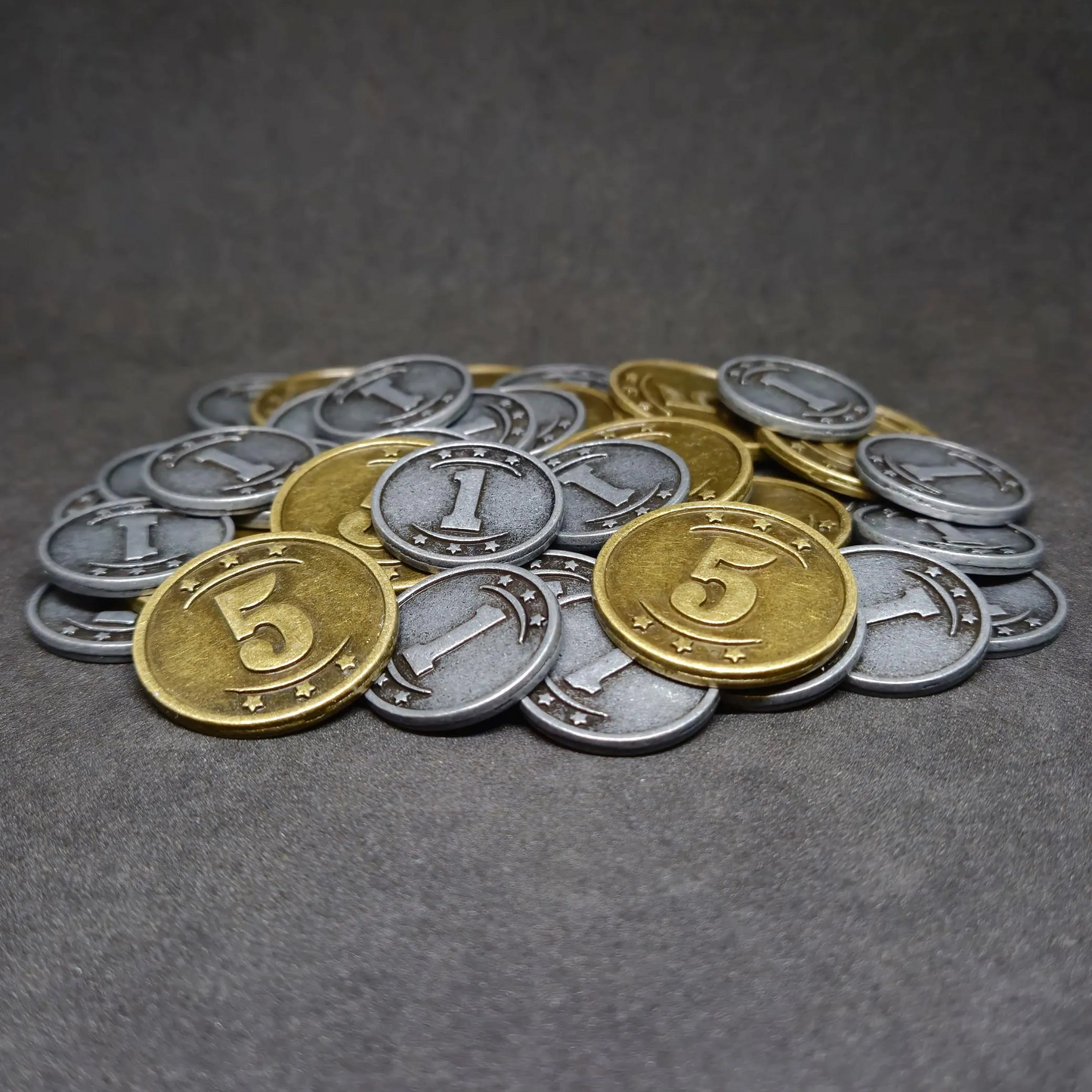 Set of silver and gold western metal coins of value 1 and 5 for board games