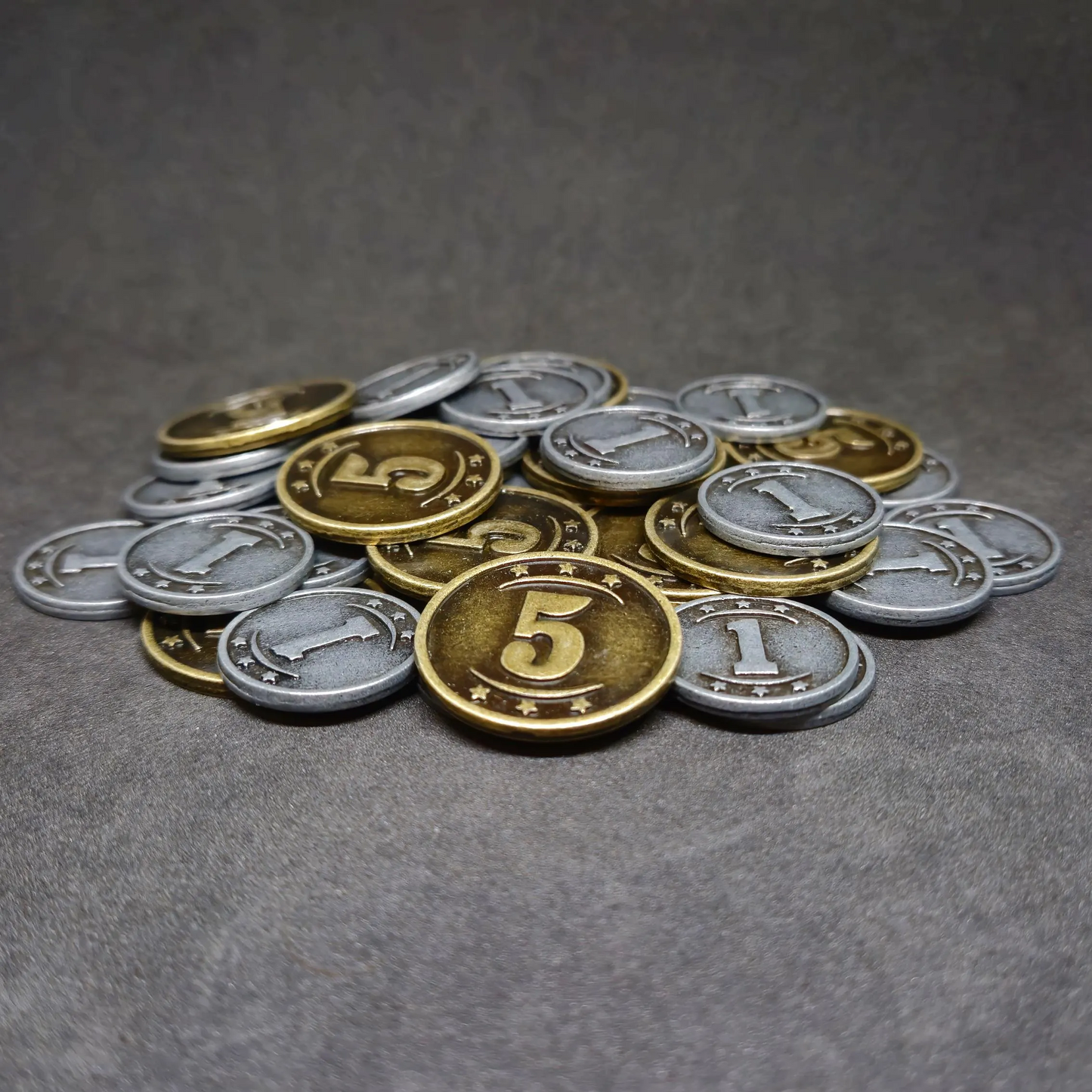 Set of silver and gold western metal coins of value 1 and 5 for board games