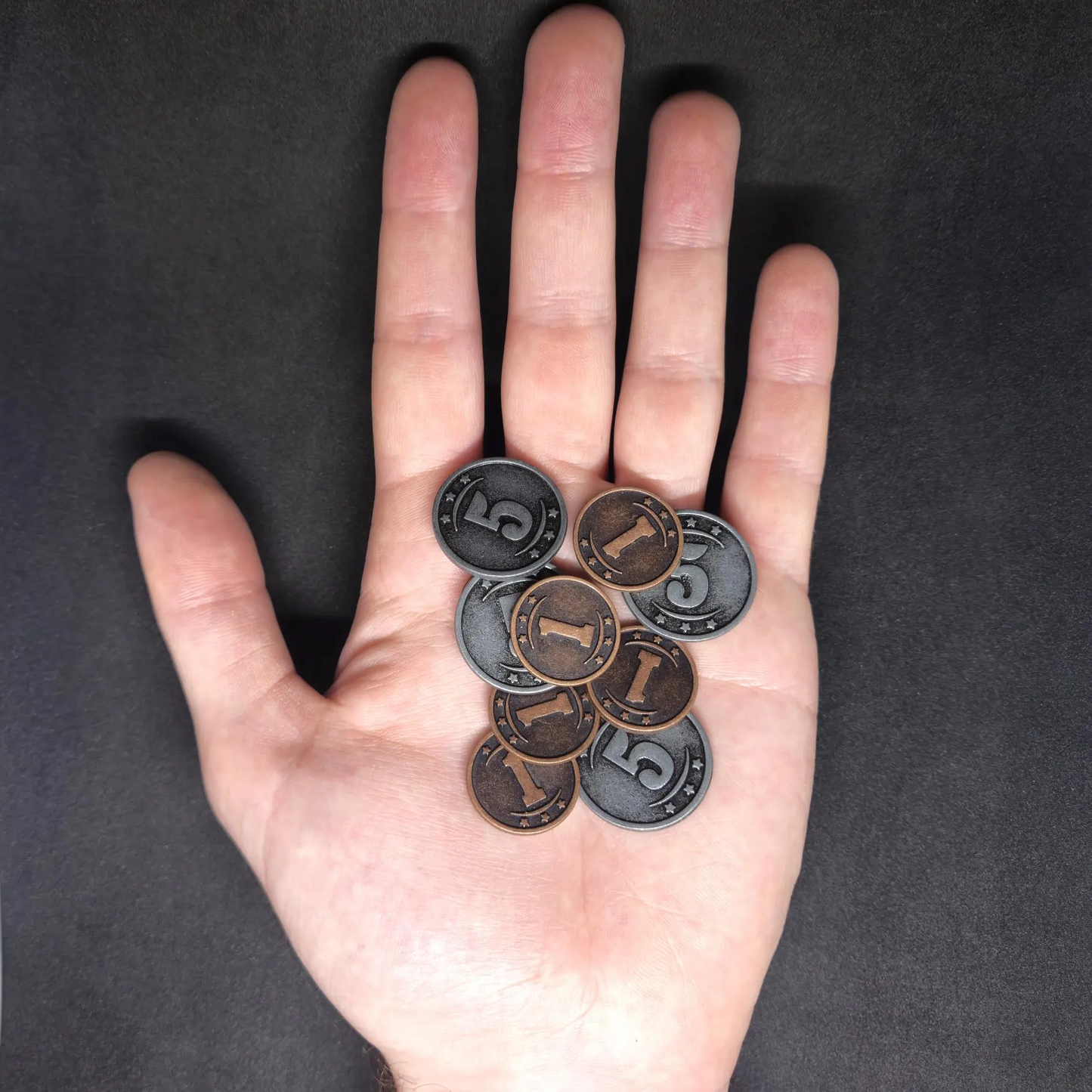 Set of bronze and silver western metal coins of value 1 and 5 for board games