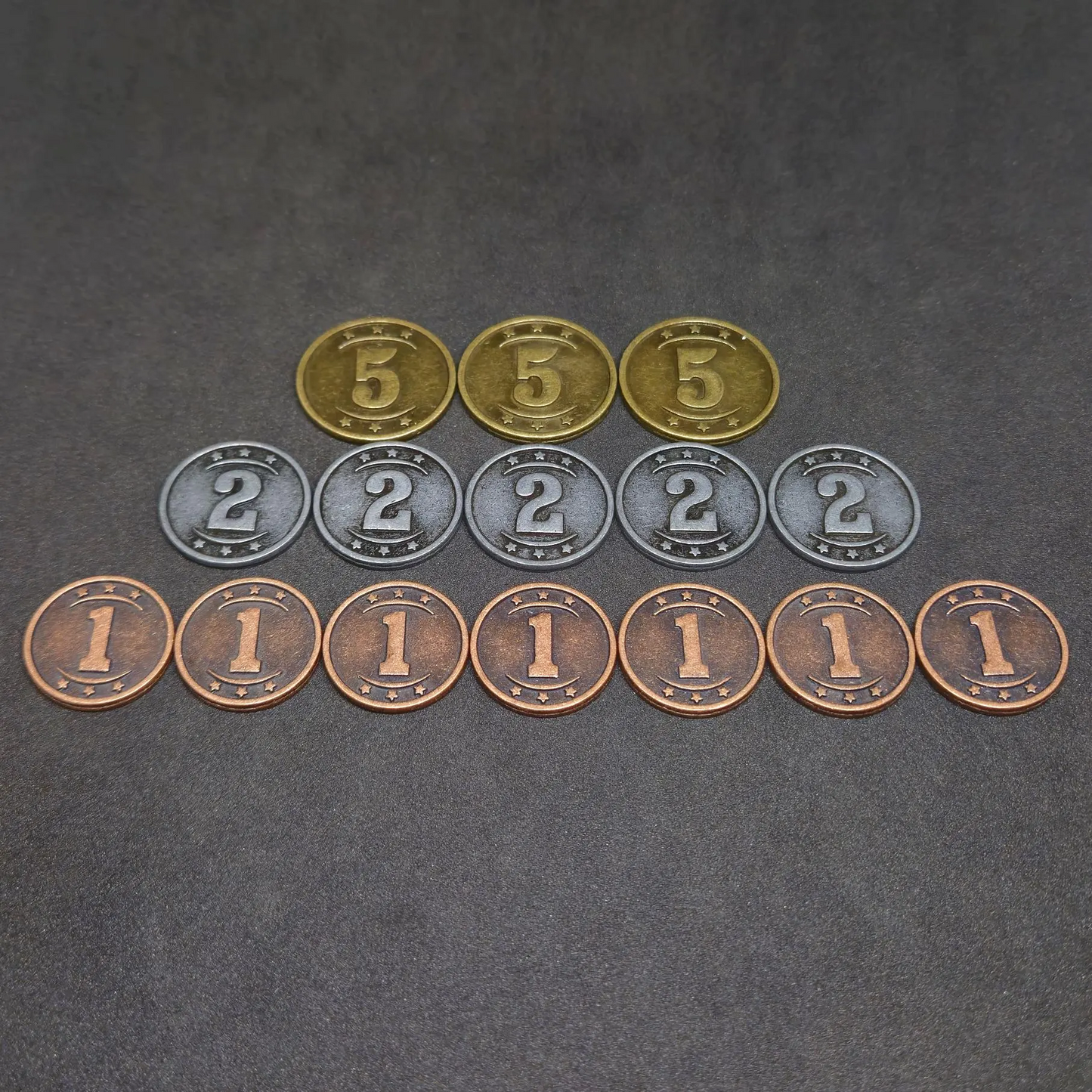 Set of bronze, silver and gold western metal coins of value 1, 2, and 5 for board games