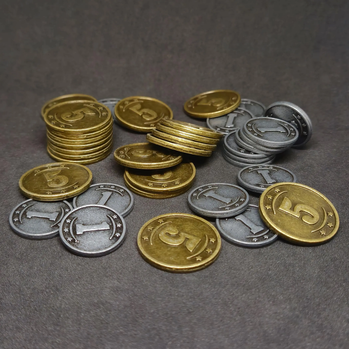 Set of silver and gold western metal coins of value 1 and 5 for board games