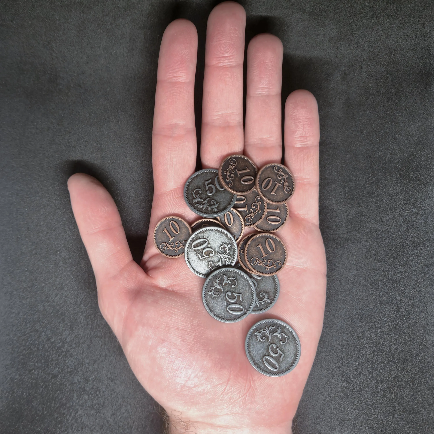 Set of bronze and silver metal coins of value 10 and 50 for board games