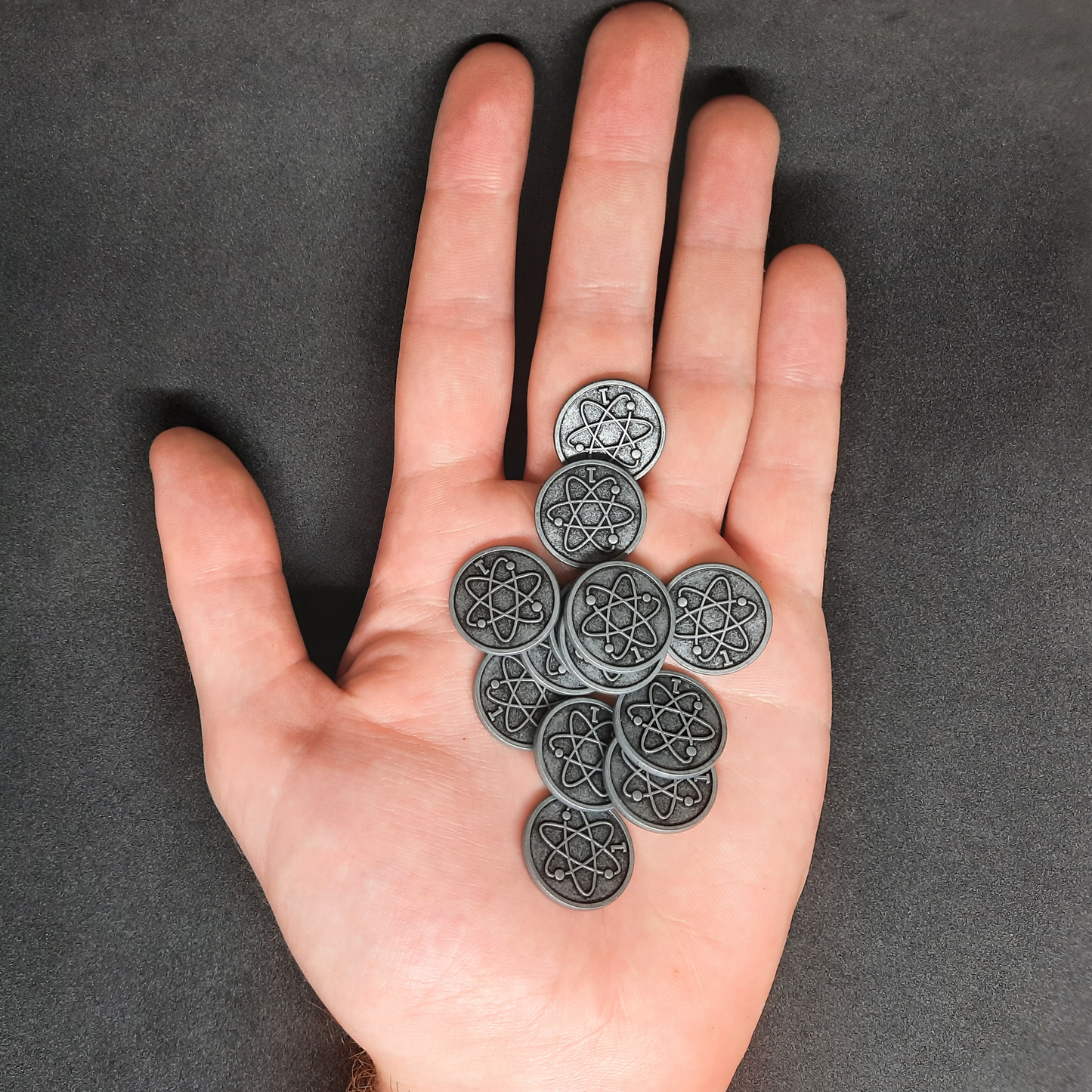 Silver spatial metal coins of value 1 for board games