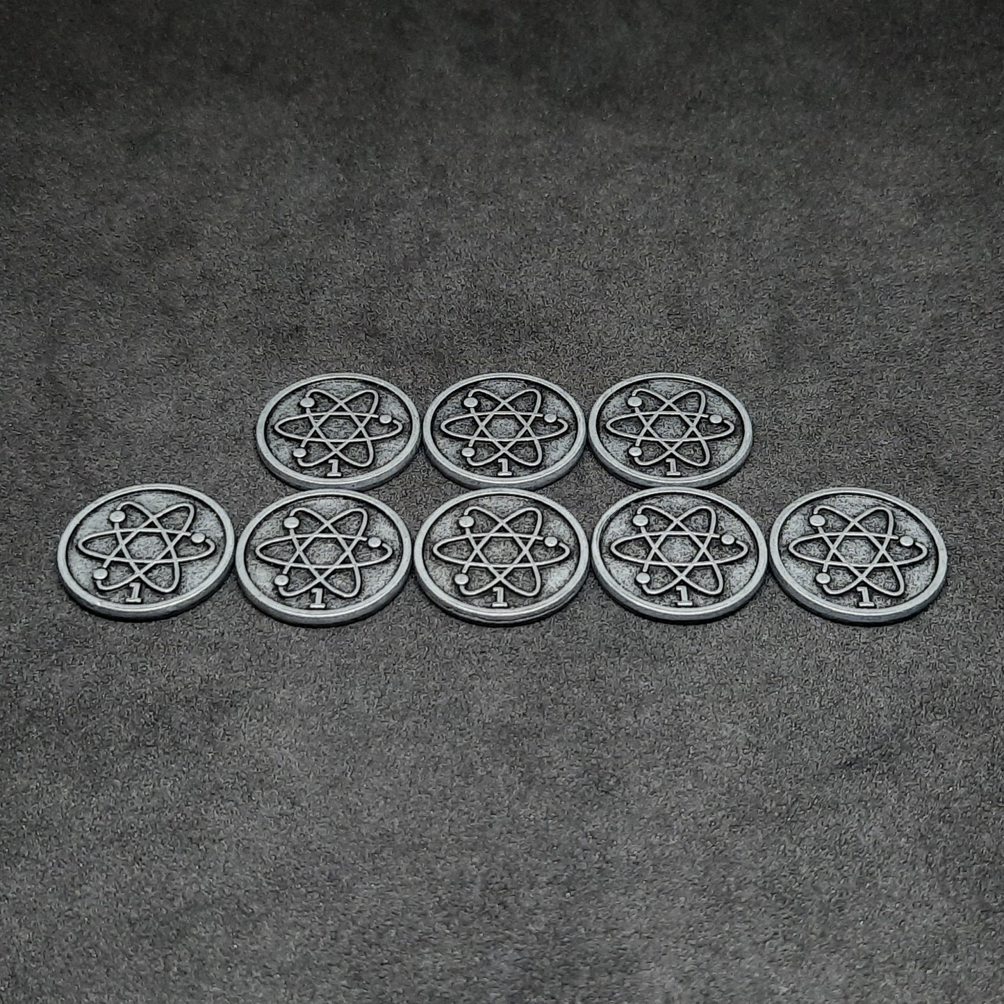 Silver spatial metal coins of value 1 for board games