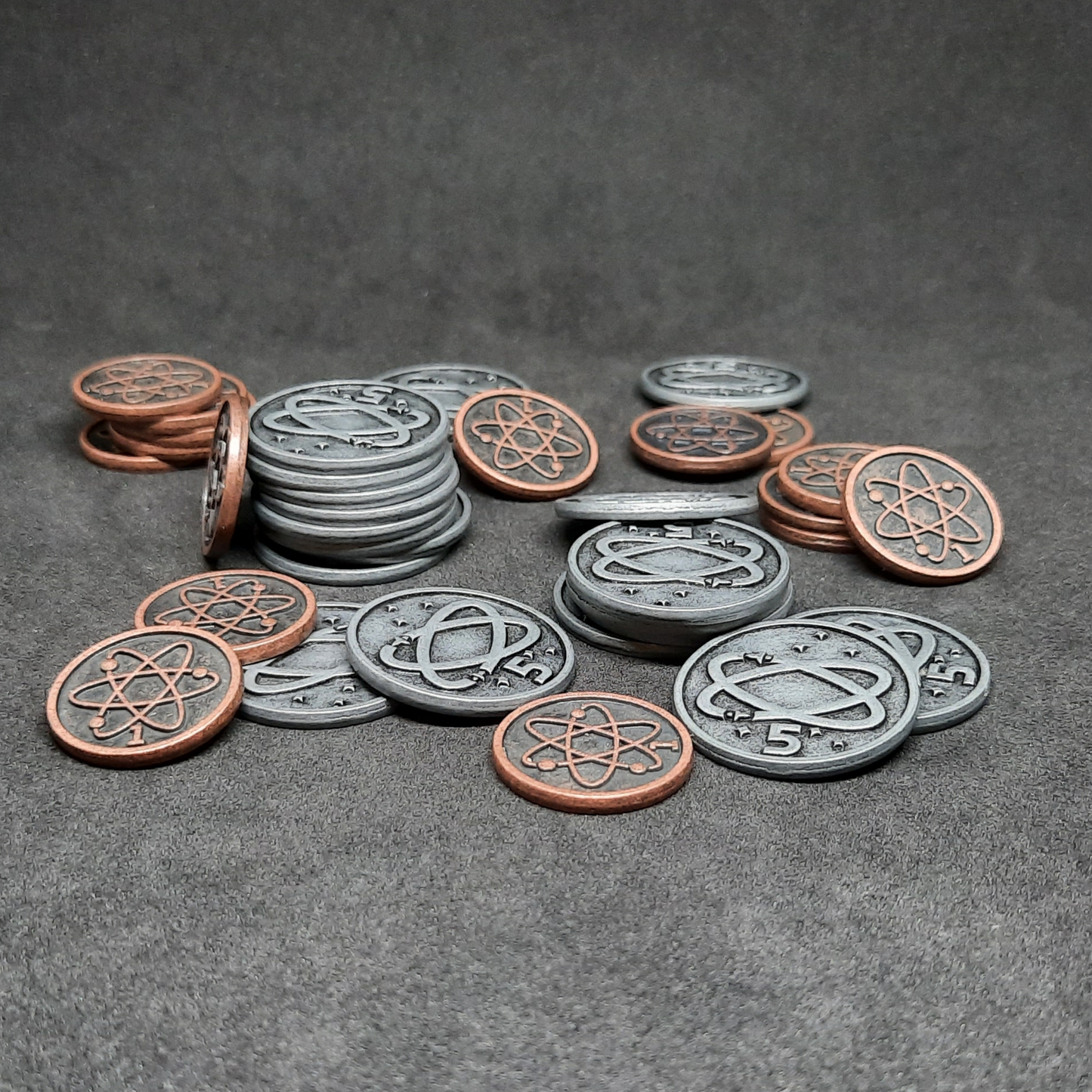 Set of spatial metal coins of value 1 and 5 for board games