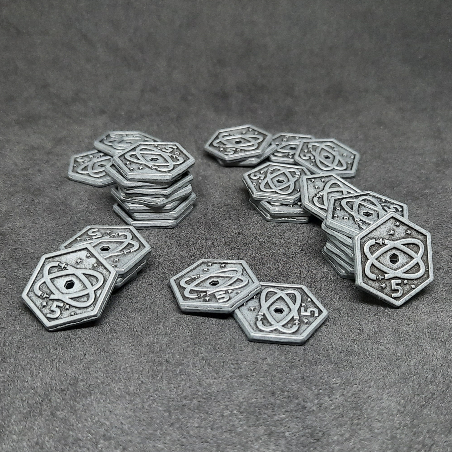 Silver spatial metal coins of value 5 for board games, hexagonal shape