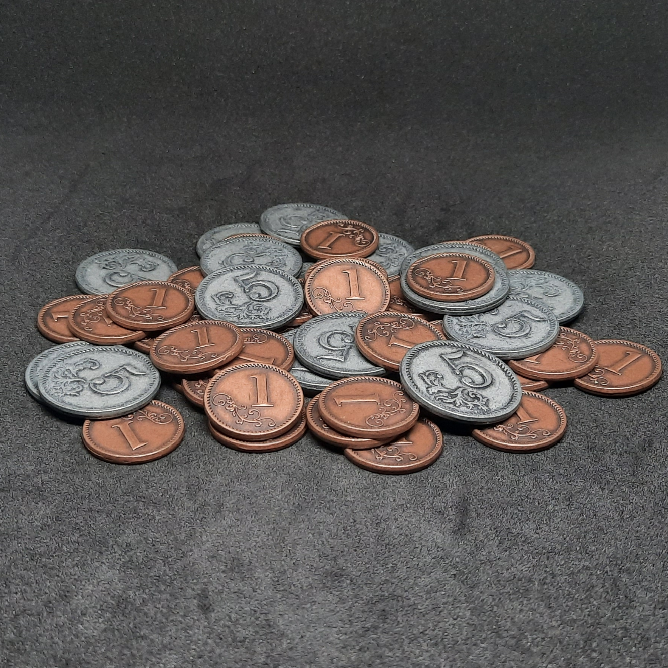 Set of bronze and silver metal coins of value 1 and 5 for board games