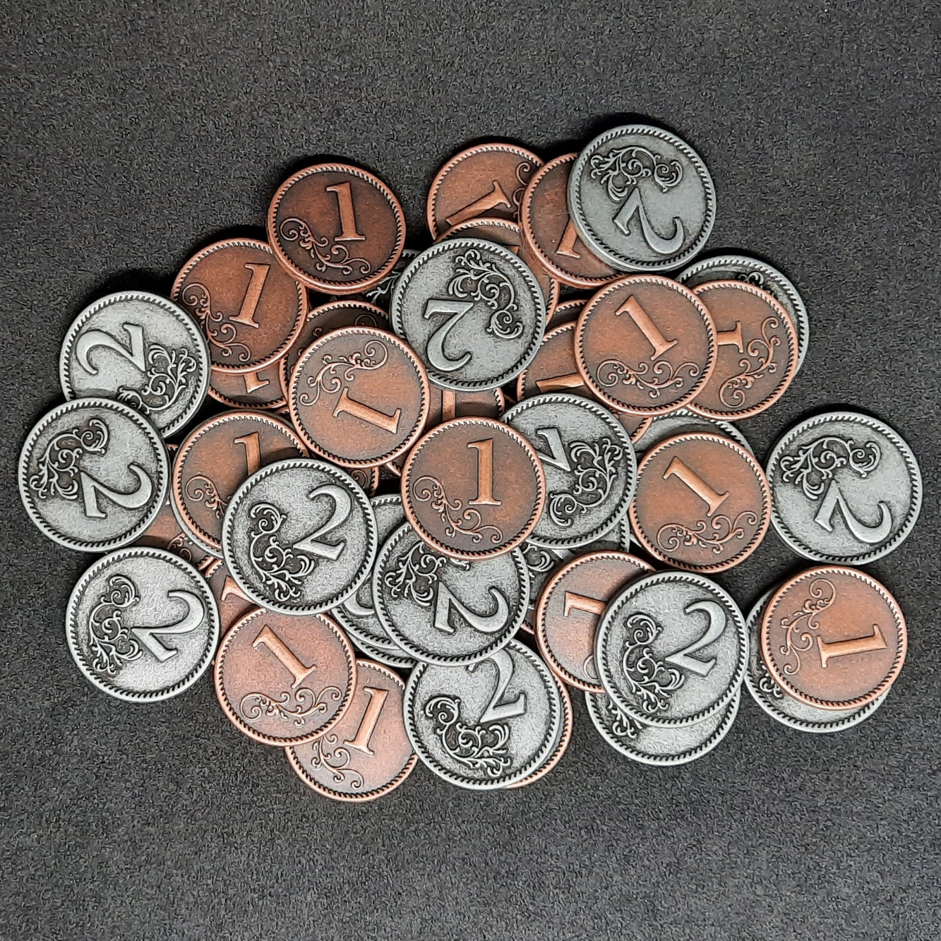 Set of bronze and silver metal coins of value 1 and 2 for board games