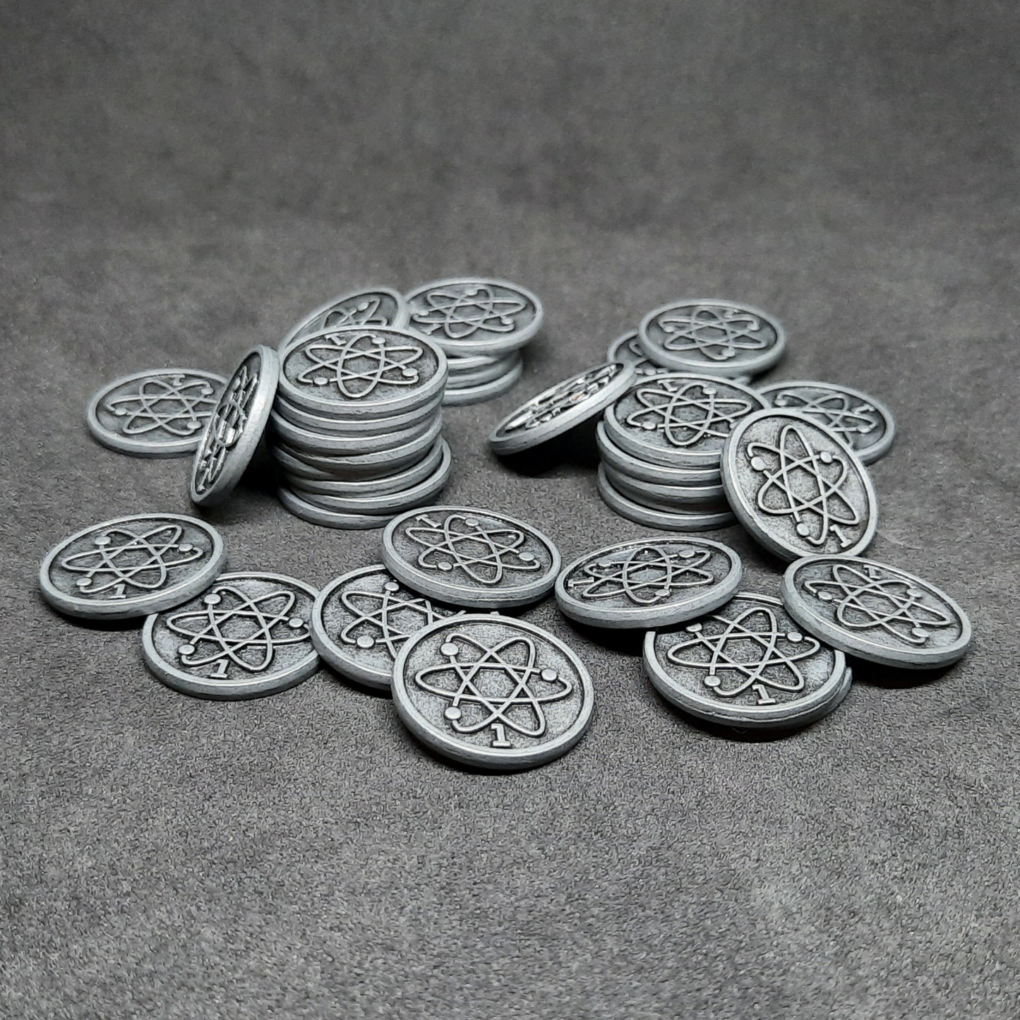 Silver spatial metal coins of value 1 for board games