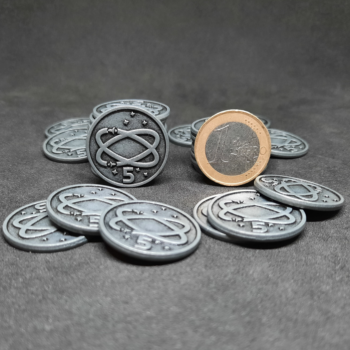 Silver spatial metal coins of value 5 for board games