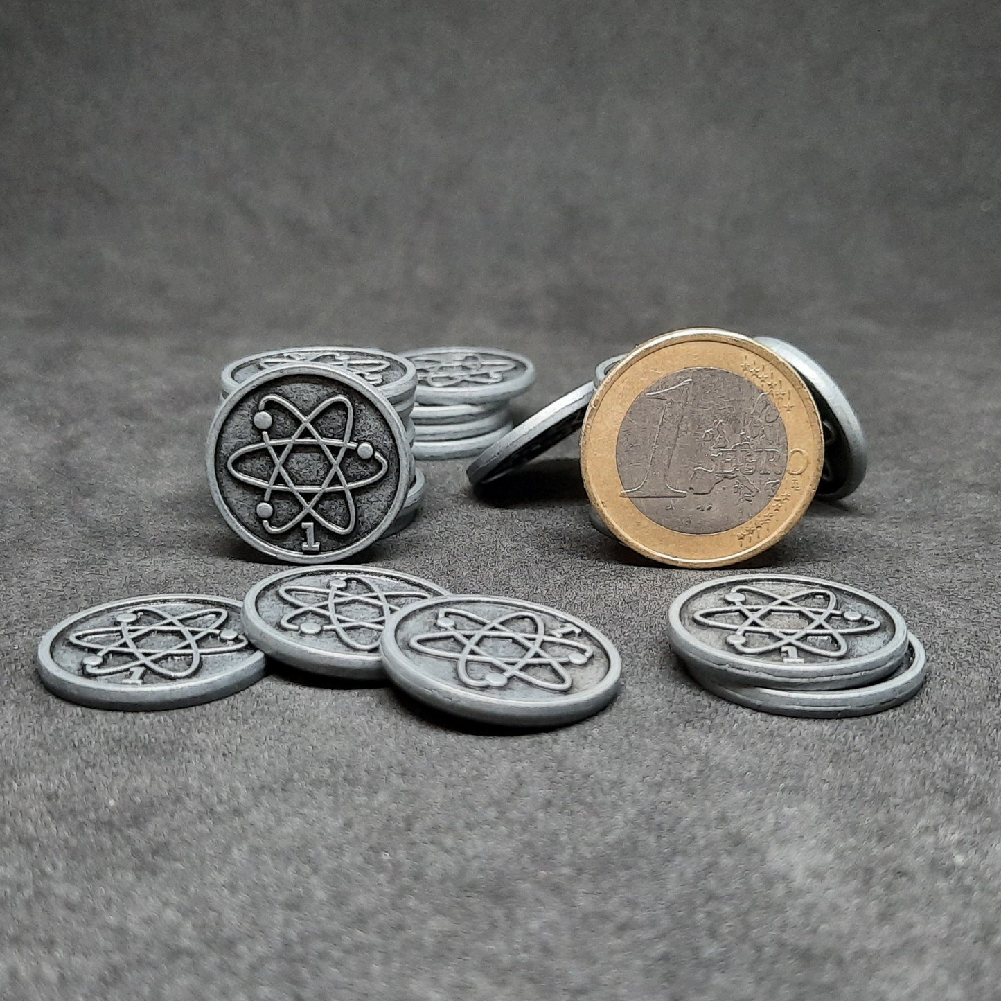 Silver spatial metal coins of value 1 for board games