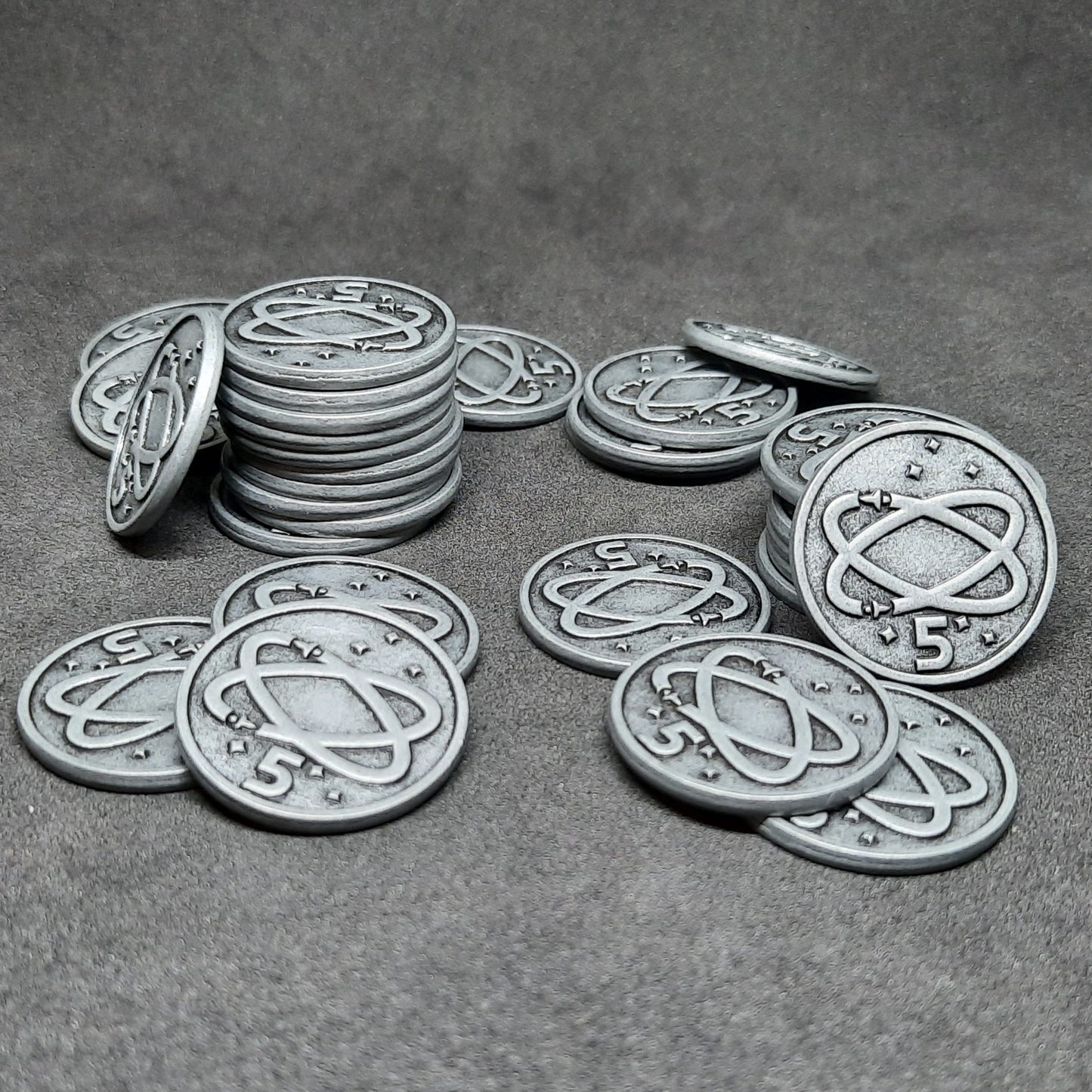 Silver spatial metal coins of value 5 for board games