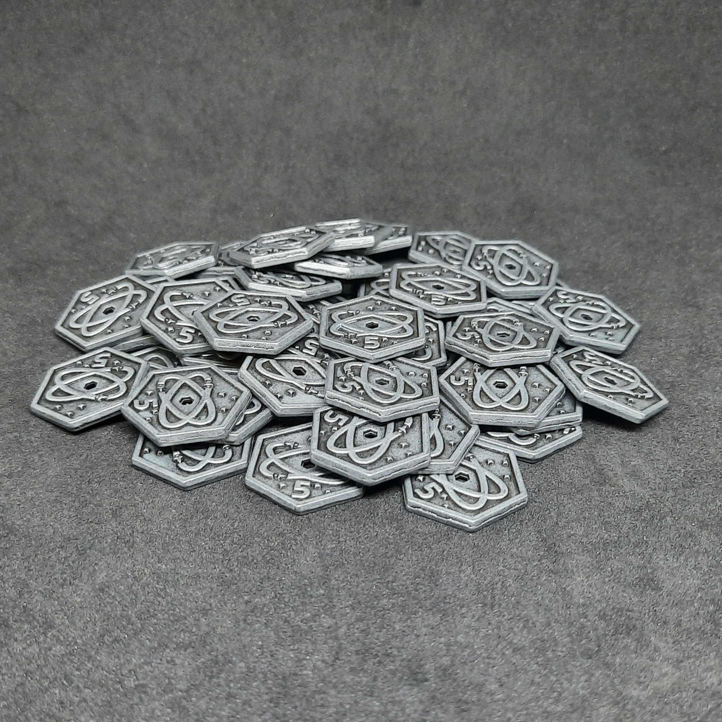 Silver spatial metal coins of value 5 for board games, hexagonal shape