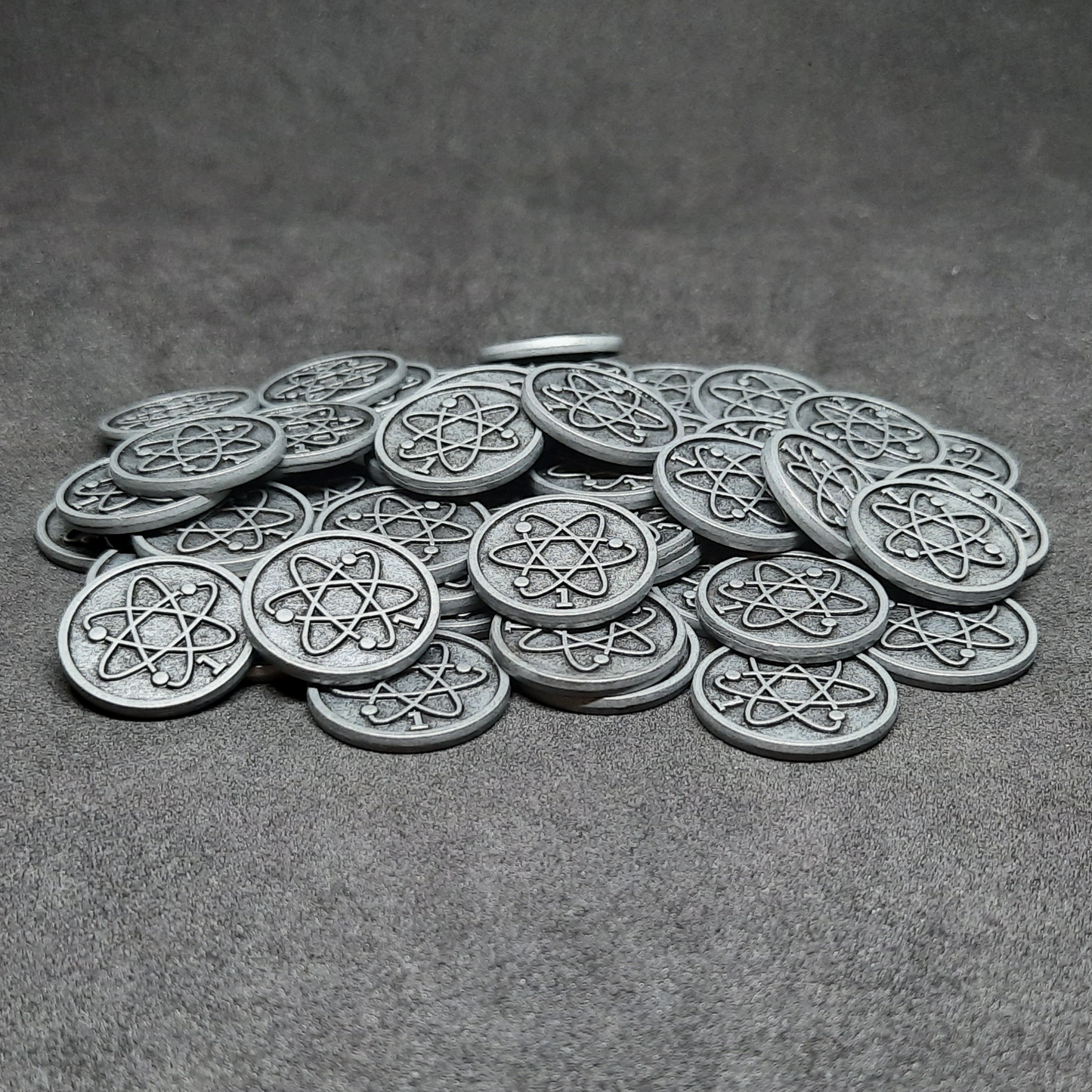 Silver spatial metal coins of value 1 for board games