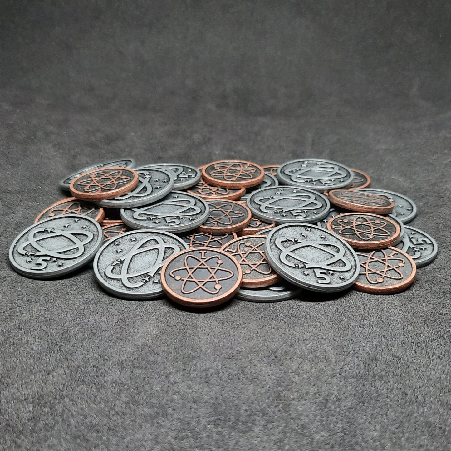 Set of spatial metal coins of value 1 and 5 for board games