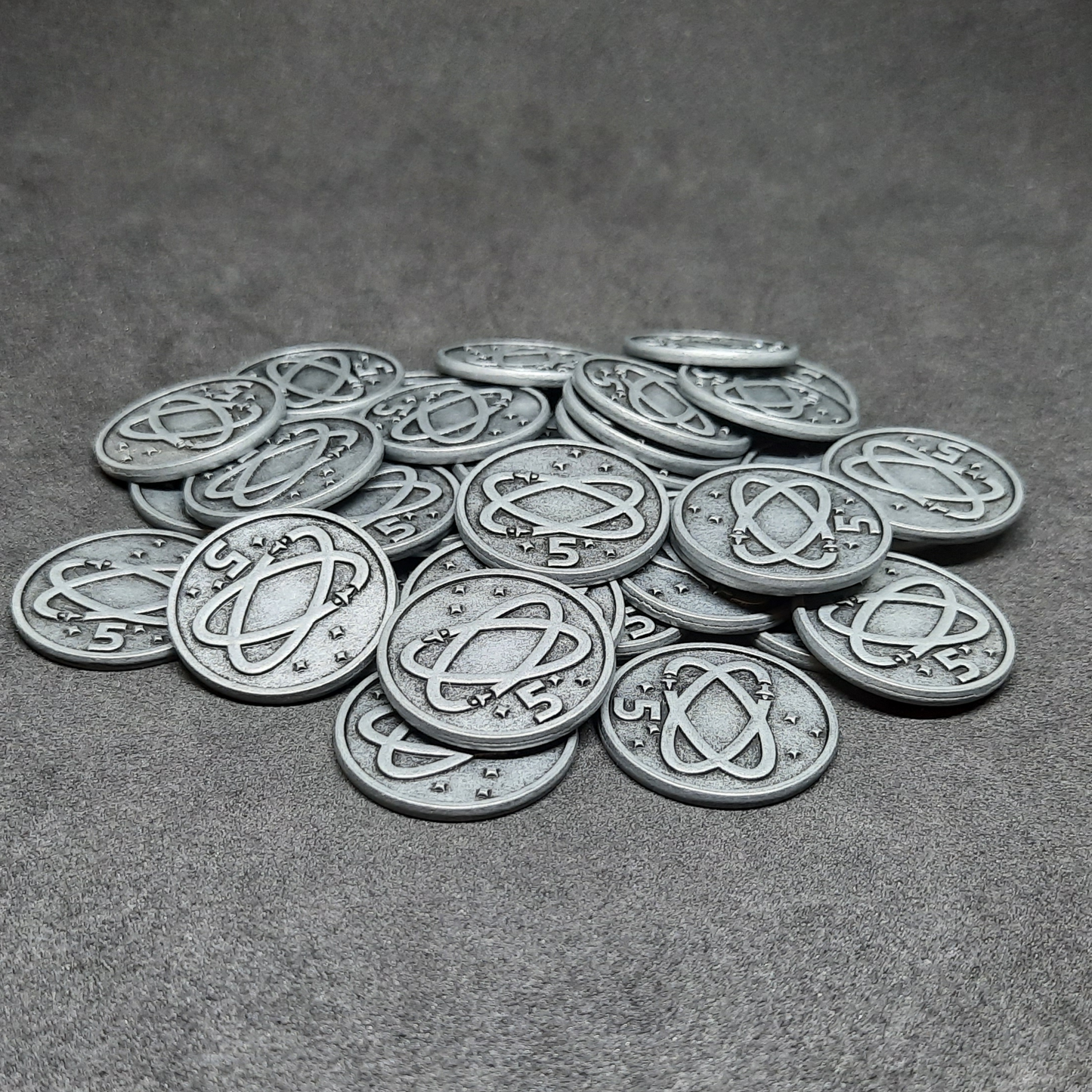 Silver spatial metal coins of value 5 for board games