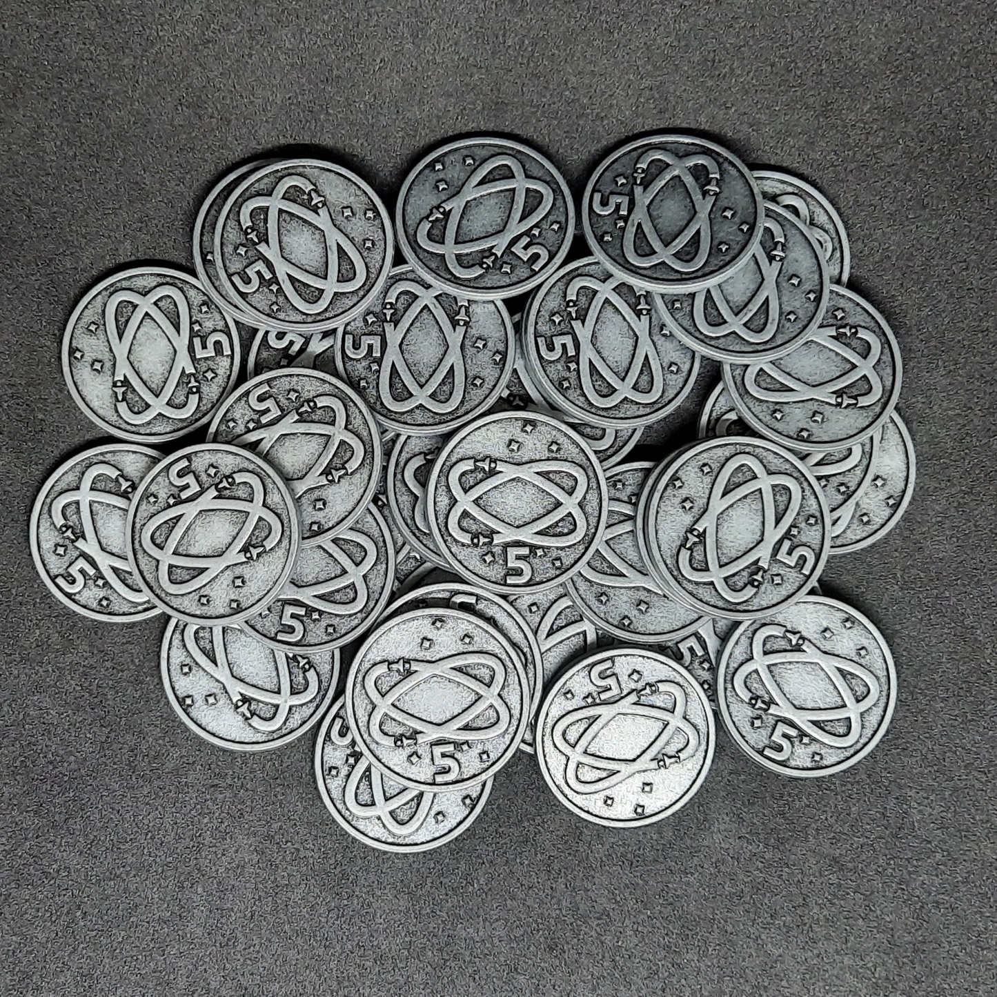 Silver spatial metal coins of value 5 for board games