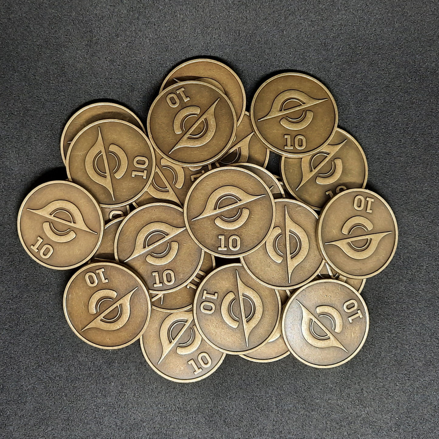 Gold spatial metal coins of value 10 for board games