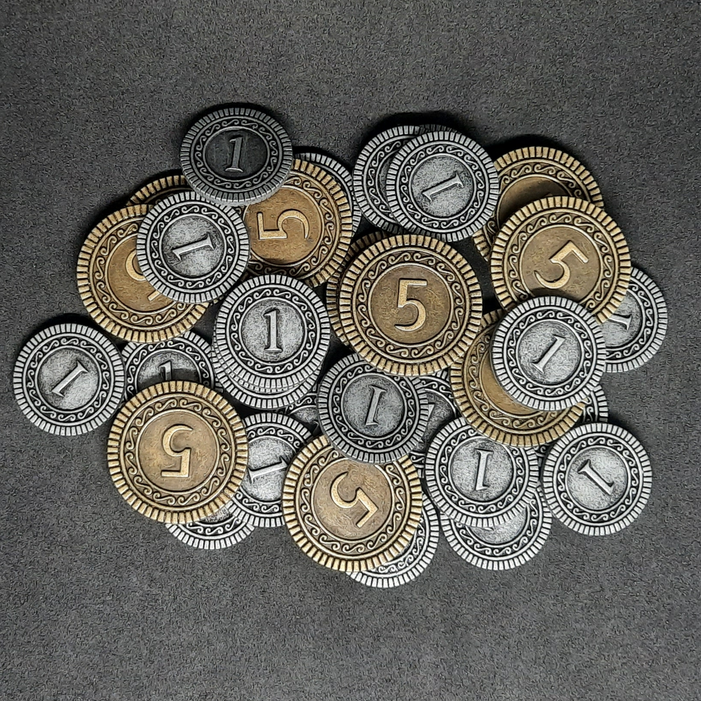 Set of silver and gold metal coins of value 1 and 5 for magic theme